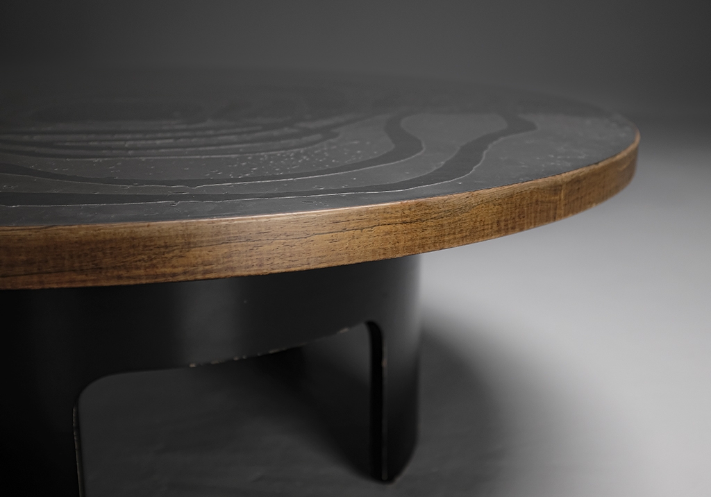Round Coffee Table in Engraved Steel and Wood: Close-up view of the top and the base