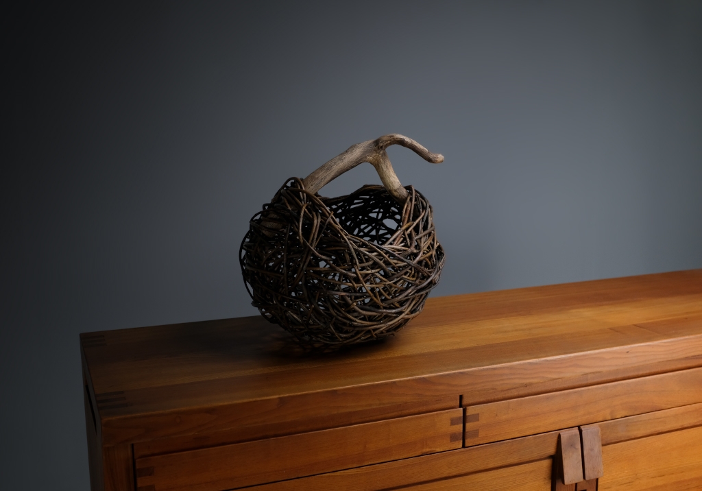 Wicker and Sauvage Oak Basket: basket on top of a sideboard
