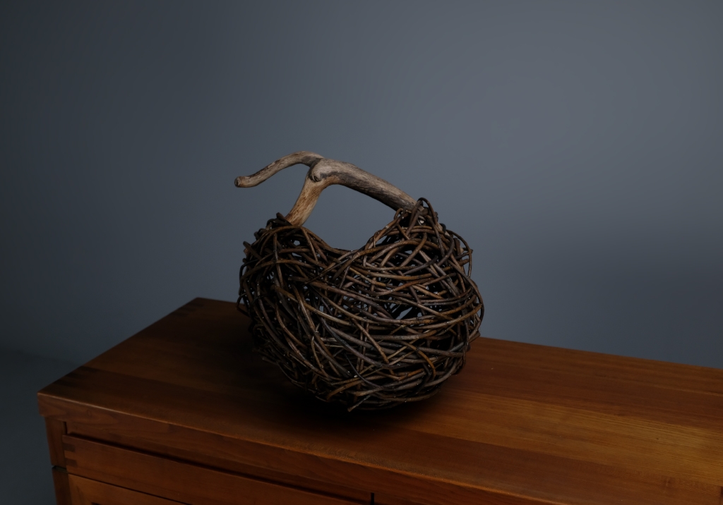 Wicker and Sauvage Oak Basket: close up of the item on top of a sideboard