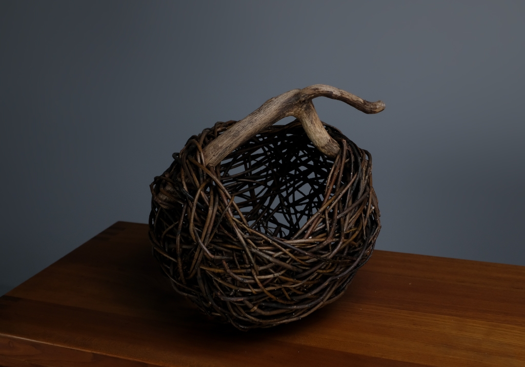 Wicker and Sauvage Oak Basket: close up of the item on top of a sideboard