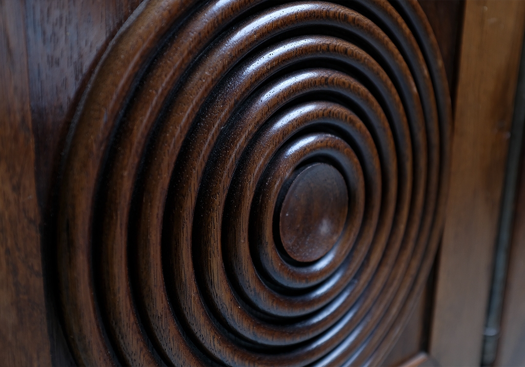 Art Deco Sideboard: closeup of the decorative rings in one of the doors