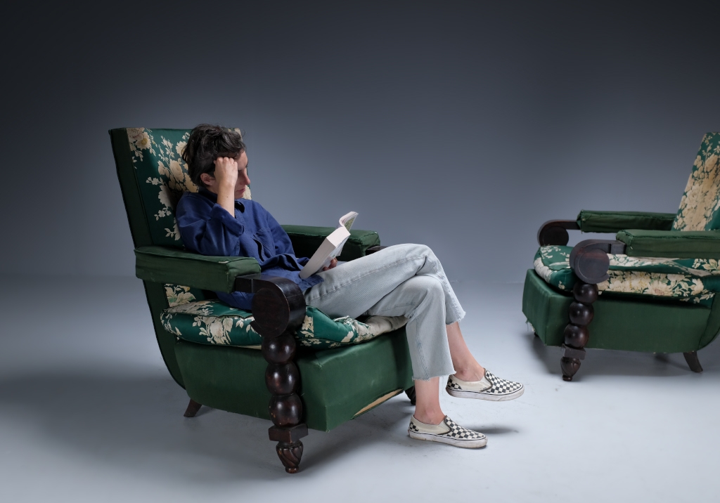 Art Deco Armchairs: general overview of a chair being used by a reading lady